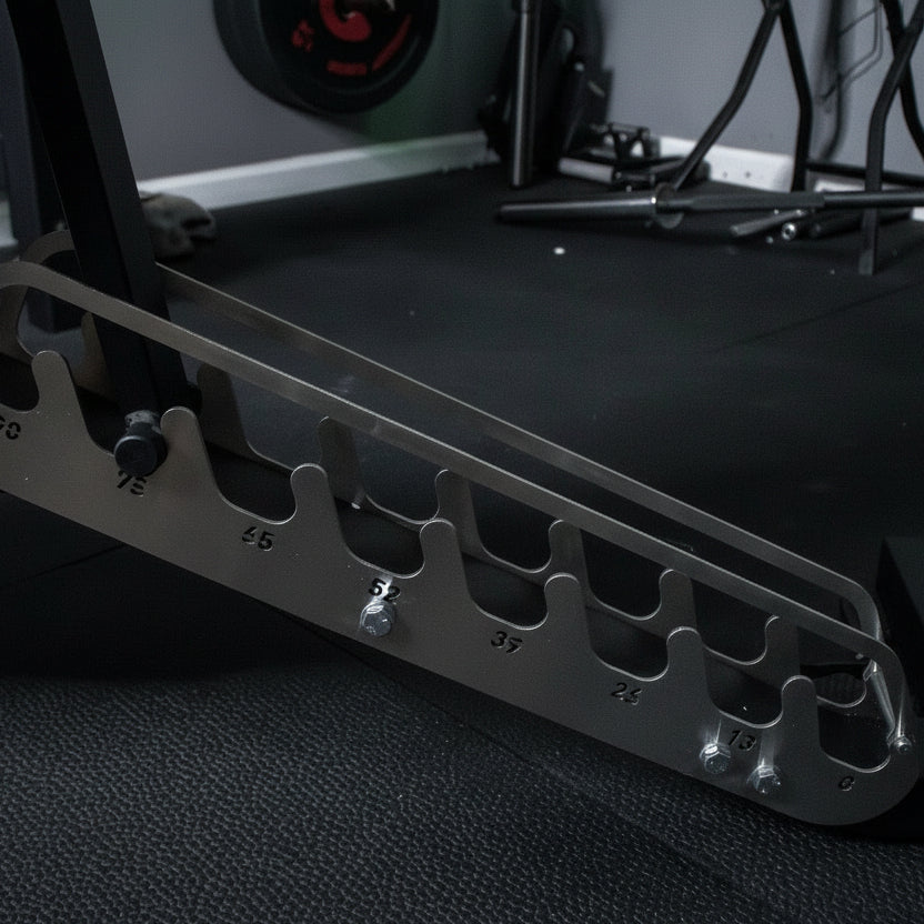 Metallic tool holder on a dark textured surface