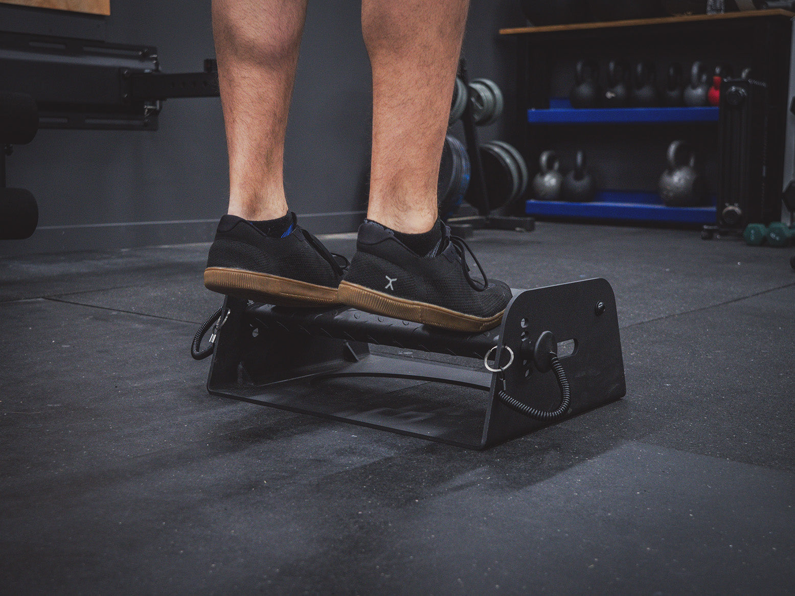 Man doing calf raises on the Flex Wedge by Exponent Edge