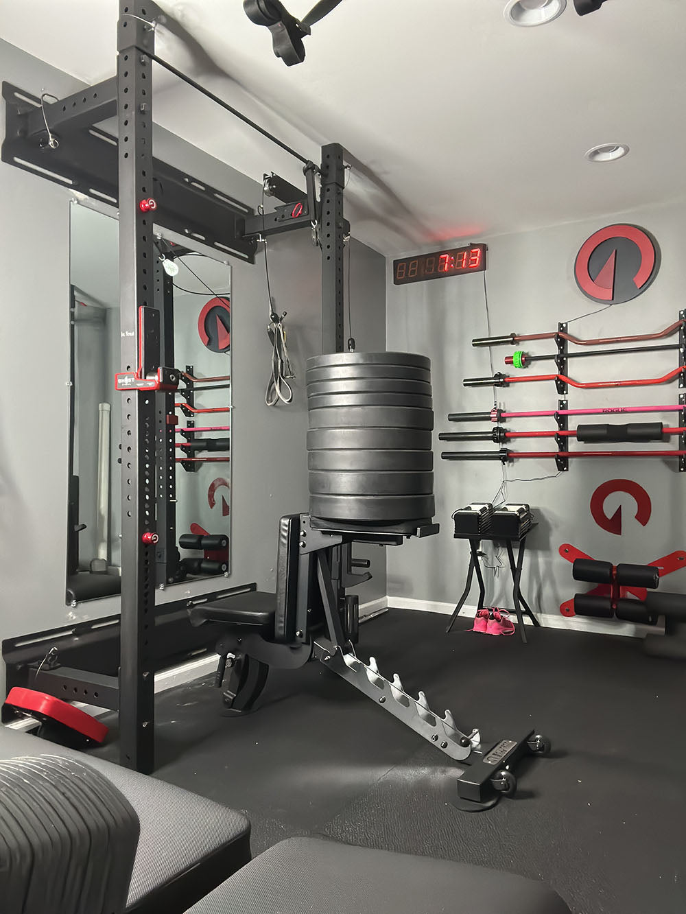 The Edge Infinity Bench is a bench that combines three separate benches all into one bench. You get the benefits of a flat bench, incline bench, and half bench all in one device. This image presents the bench supporting several weight plates to show its durability.