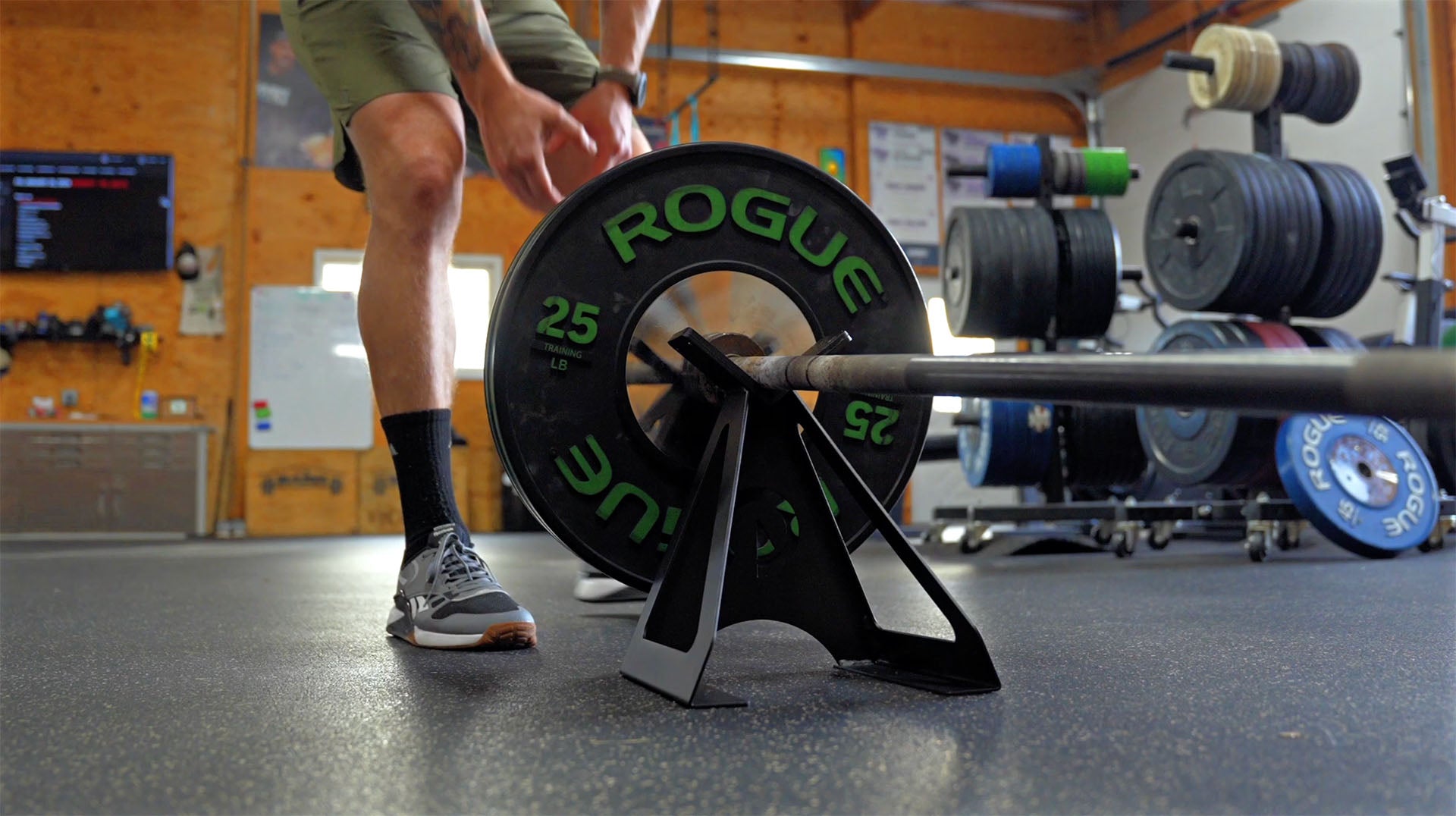 Compact landmine stand holding a landmine bar with weights