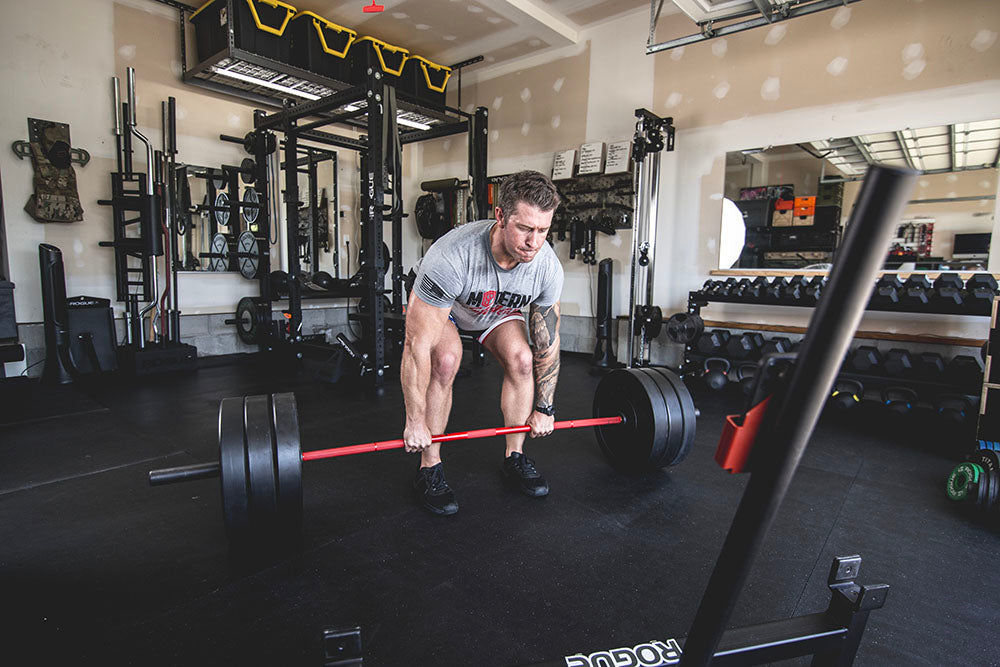 The Infinity Bar is a hybrid Bodybuilding and Powerlifting barbell. This images presents the Infinity Bar being used for a squat workout.