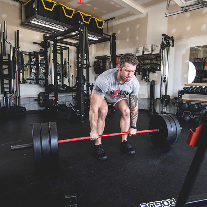 The Infinity Bar is a hybrid Bodybuilding and Powerlifting barbell. This images presents the Infinity Bar being used for a squat workout.
