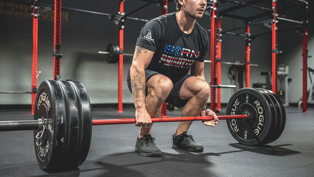 The Infinity Bar is a hybrid Bodybuilding and Powerlifting barbell. This images presents the Infinity Bar being used for a squat workout.