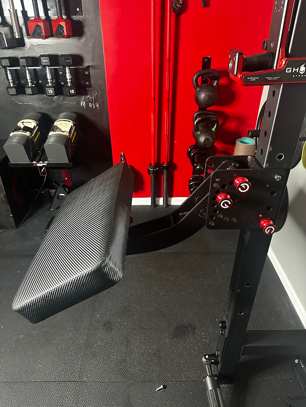 Custom Exponent Edge Magnetic pins fit all major brands of squat racks, power racks, and accessories, including Exponent Edge workout equipment. This image presents the Magnetic Edge Pins being used to attach workout equipment to a squat rack.