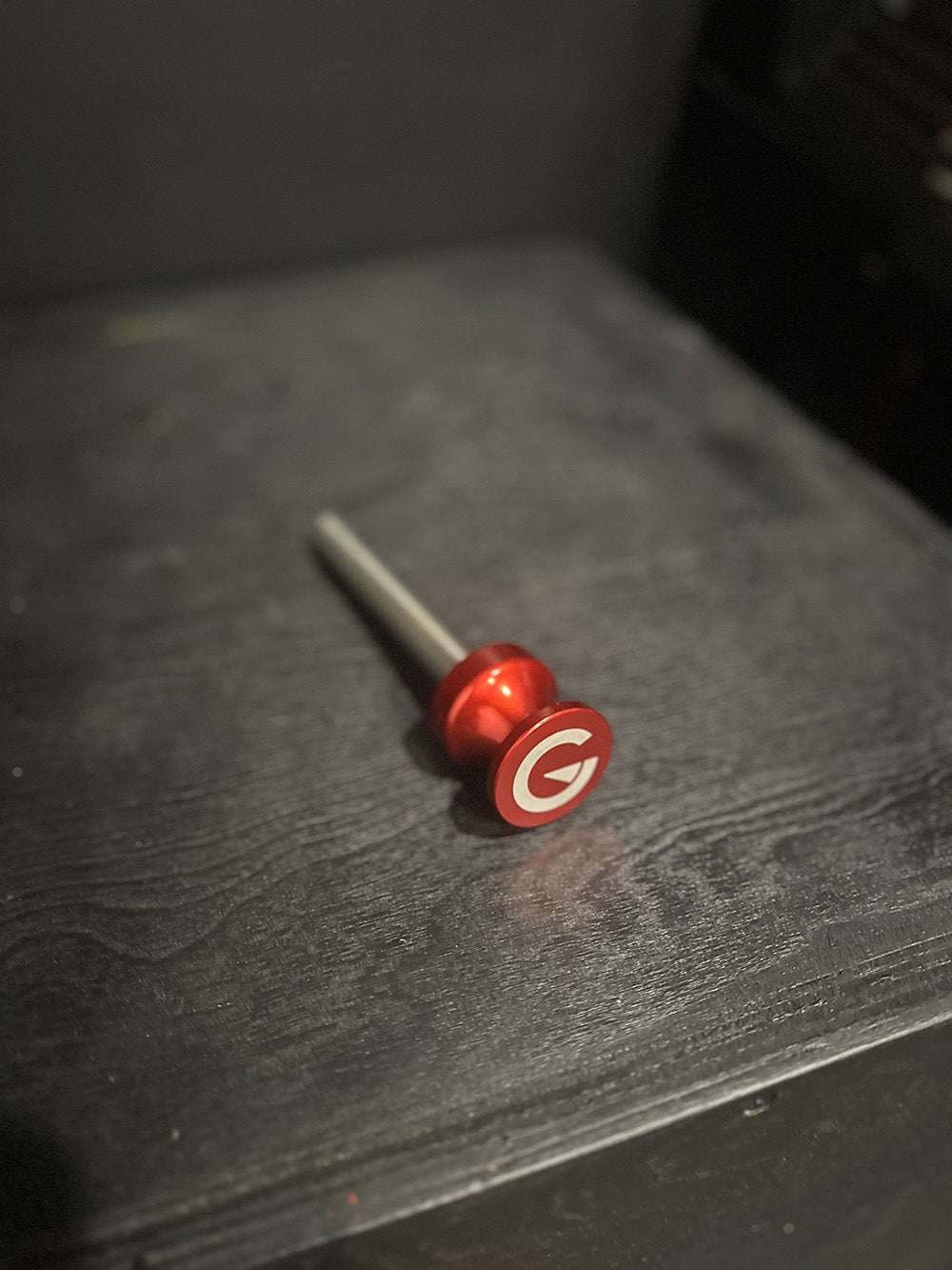 Custom Exponent Edge Magnetic pins fit all major brands of squat racks, power racks, and accessories, including Exponent Edge workout equipment. This image presents the Magnetic Edge Pins in red from an angled, above view.